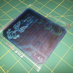 Once I file down the marked bits I'm going to seal the "screen" onto the acrylic. I purchased some sample sheets of light blue and turquoise colored vellum online. Perfect amount of transparency. I resized the reference image to fit the screen opening and tada!